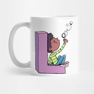 boy blows soap bubbles while sitting on the letter L Mug